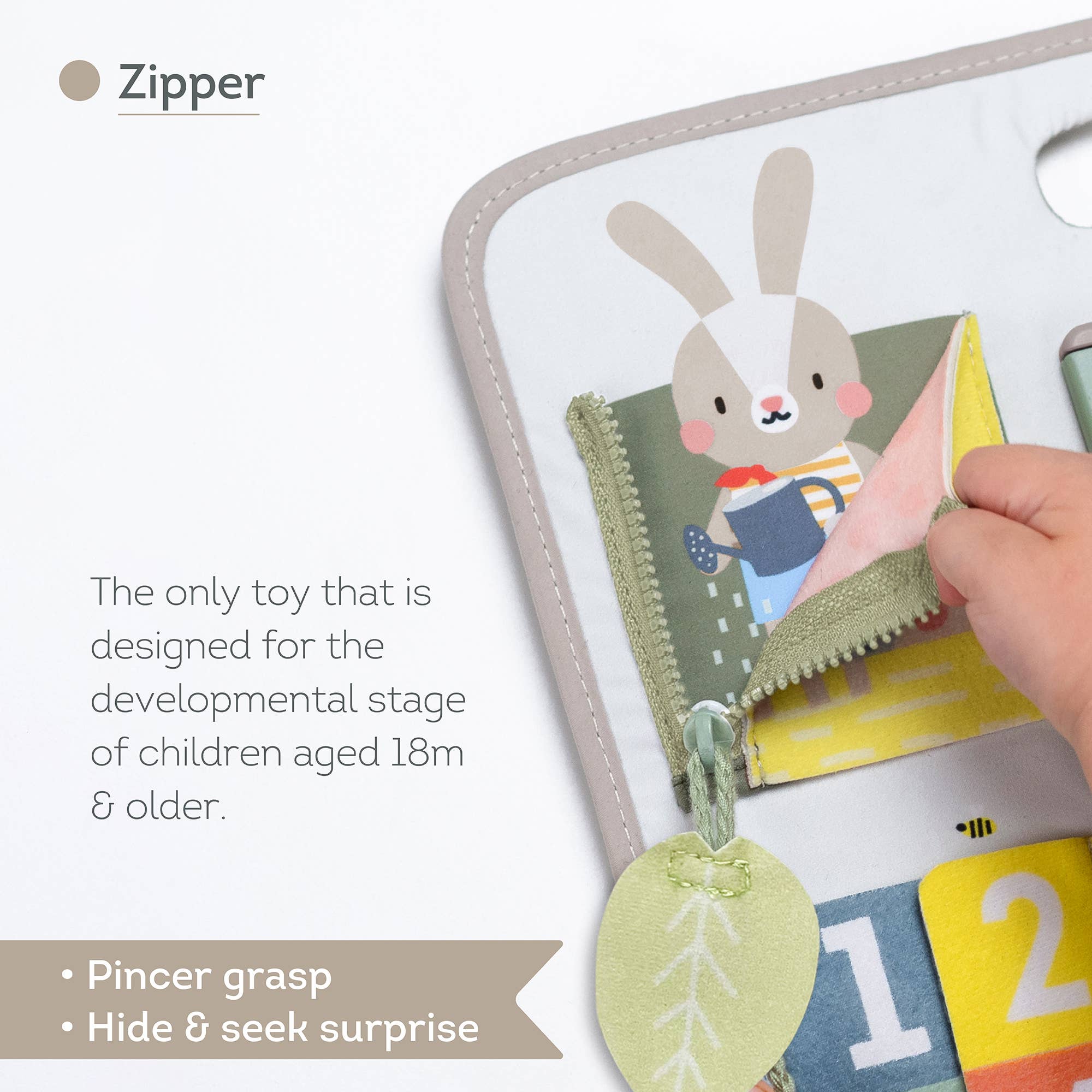 Toy with zipper and cartoon rabbit design, suitable for children aged 18 months and older.