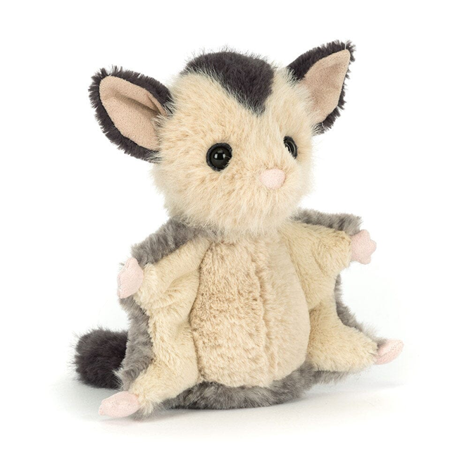 Plush toy resembling a sugar glider possum on a white background